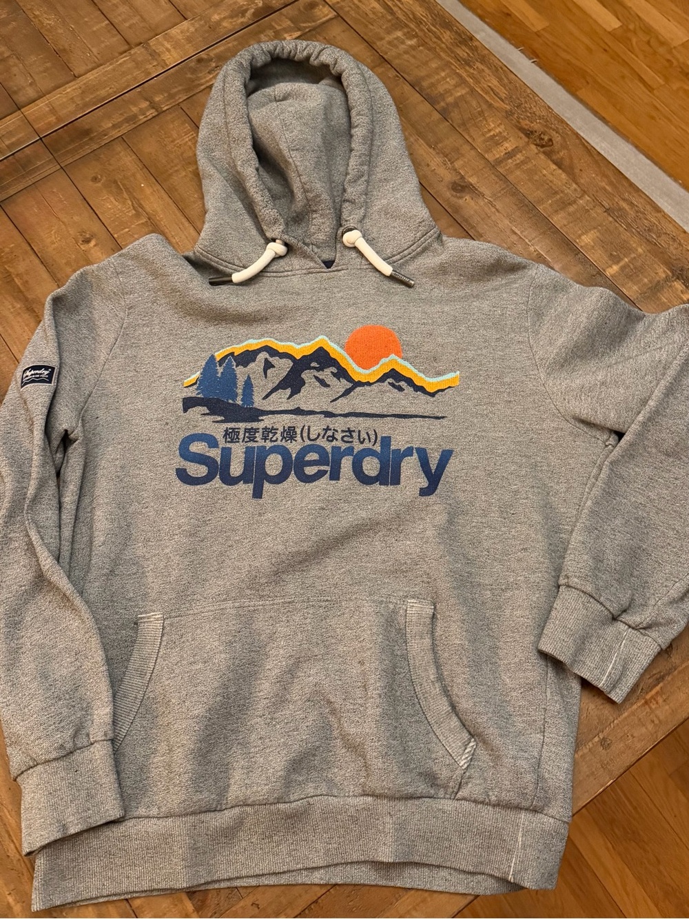 Superdry Grey Hoodie with Blue Logo and Orange Sun Graphic